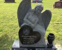 This is another example of a single upright monument. This one shows just how much you can personalize your loved one's monument.